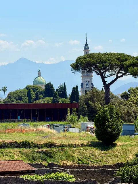 Formal gardens beneath a mountain backdrop, Italy