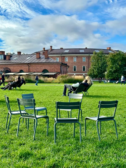Outdoor tables on a waterfront lawn, Russia