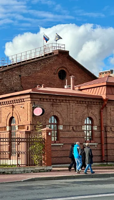 A red building beneath a cloudy sky, Russia