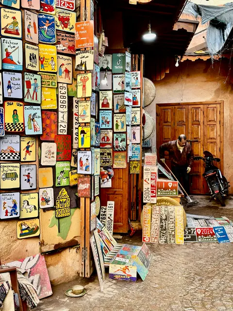 Artwork lining a small shop entrance, Morocco