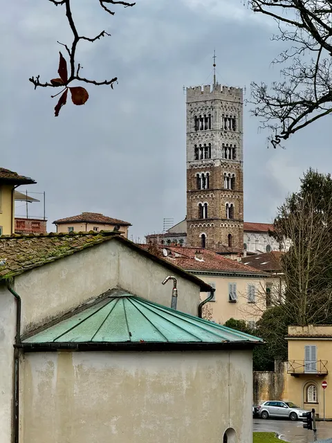 A church tower above a quiet square, Italy