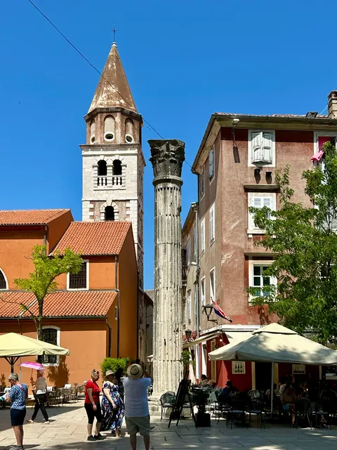 A stone bell tower above the rooftops, Croatia