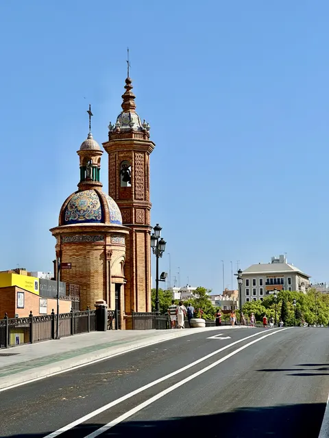 Twin church towers beside a bridge, Spain
