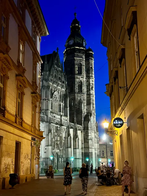 A church tower at the end of a night street, Slovakia