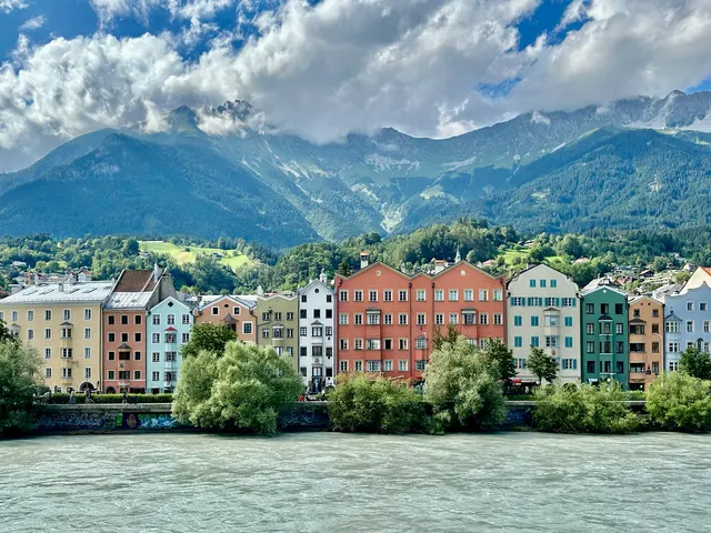 Colorful riverside houses beneath the Alps, Austria