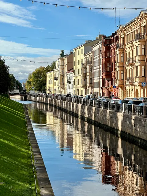 Buildings reflected in a canal, Russia