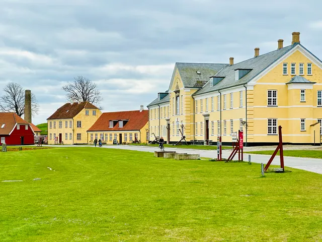 Bright houses beside a green lawn, Sweden