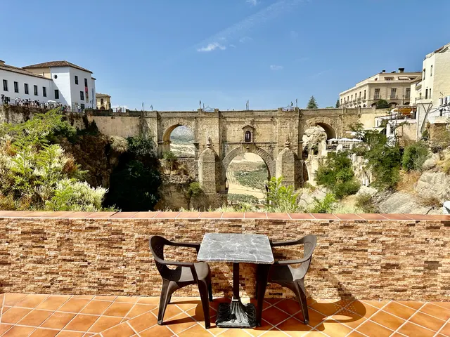 A terrace overlooking a stone bridge, Spain