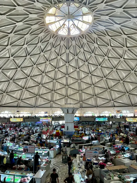 Market stalls beneath a broad domed roof, Uzbekistan