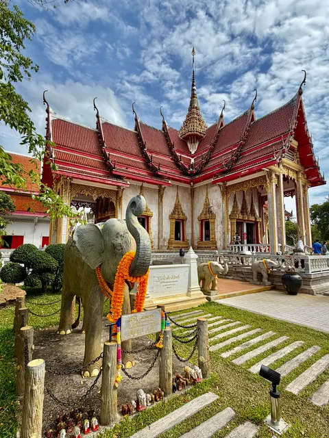 Temple buildings around a green courtyard, Thailand
