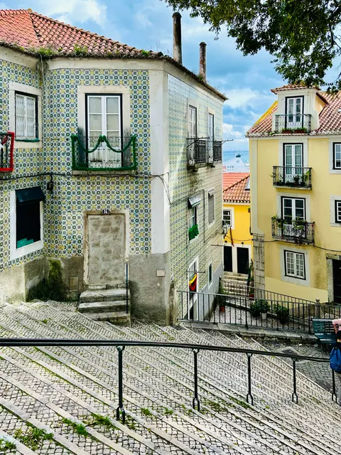 A quiet lane between tiled houses, Portugal