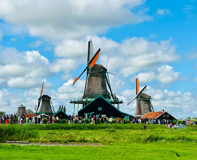Windmills beneath a bright sky, Netherlands
