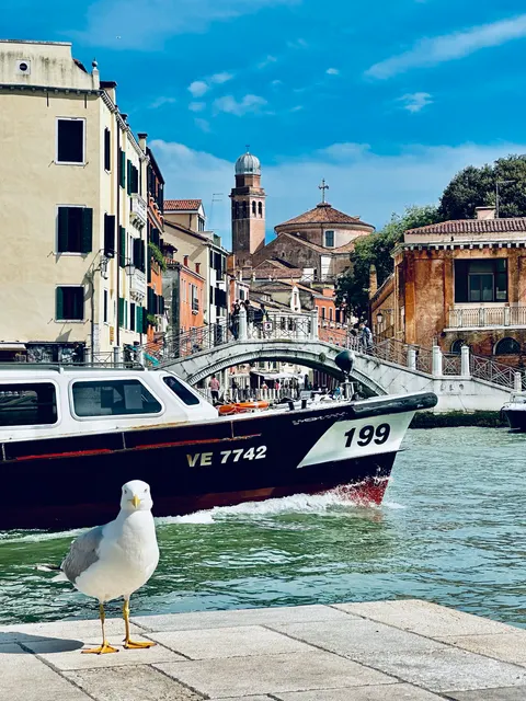 A boat beside a Venetian canal, Italy