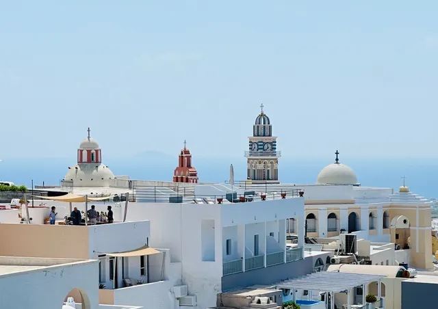 White buildings and church towers on Santorini, Greece
