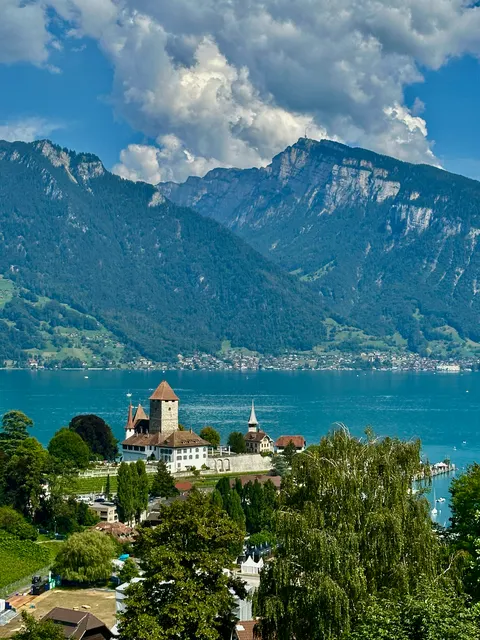 An Alpine village beside a turquoise lake, Switzerland