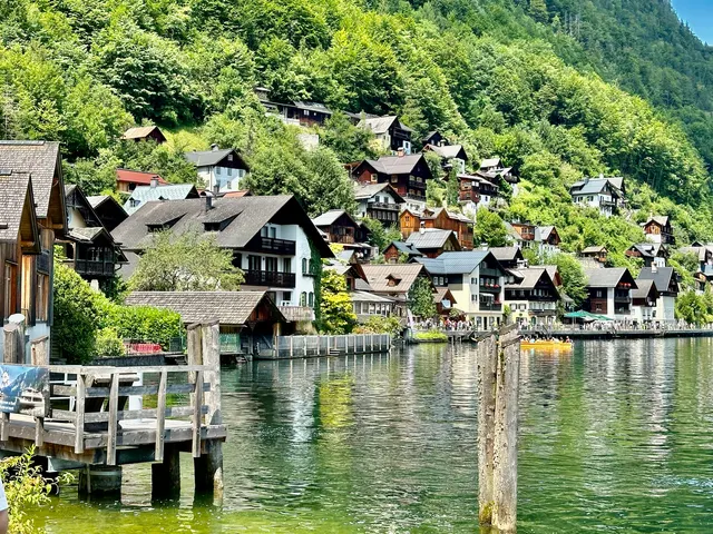 Lakeside houses reflected in still water, Austria