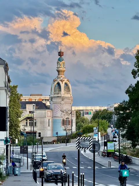 An ornate tower above a city street, France
