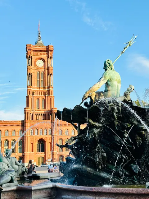 A fountain beside a red-brick tower, Germany