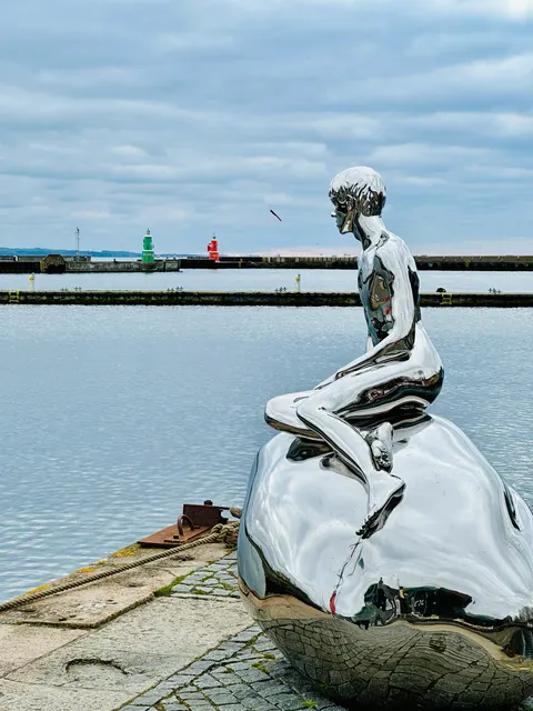 The Little Mermaid overlooking the harbor, Denmark