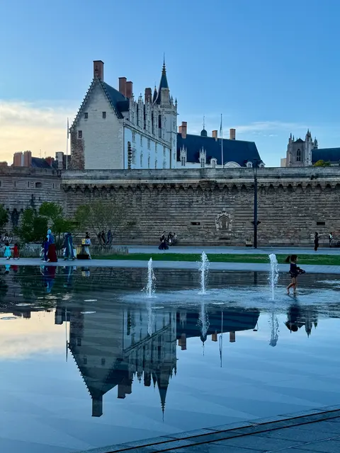 A castle reflected in a pool, France