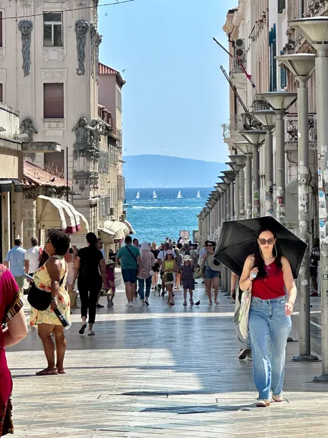 A narrow street opening toward the sea, Croatia
