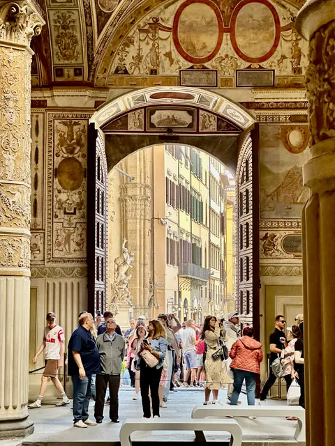 Visitors in an ornate gallery, Italy