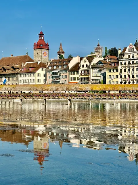 Lakeside houses reflected in still water, Switzerland