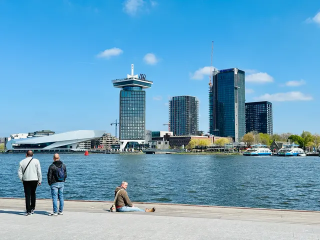 Rotterdam’s waterfront beneath blue skies, Netherlands
