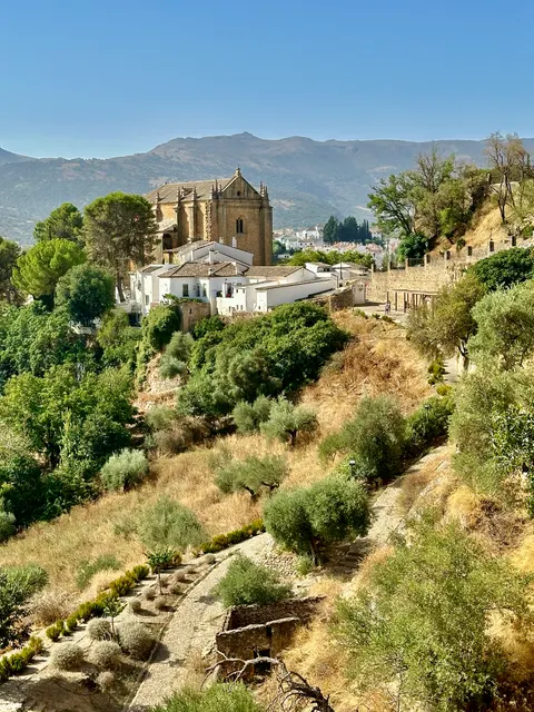 A hillside church above a rugged valley, Spain