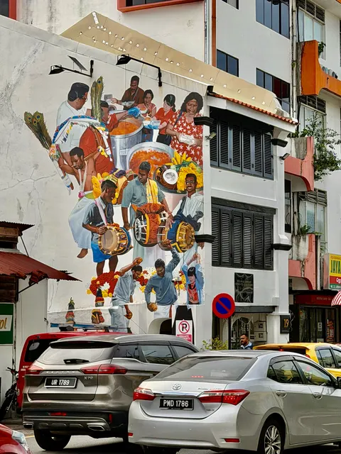 A colorful mural beside parked cars, Malaysia