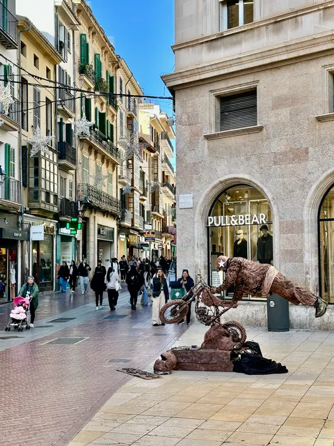 Colorful buildings along a shopping street, Spain