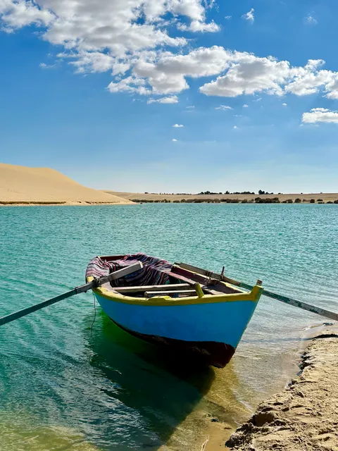 A boat moored in a turquoise lagoon, Egypt