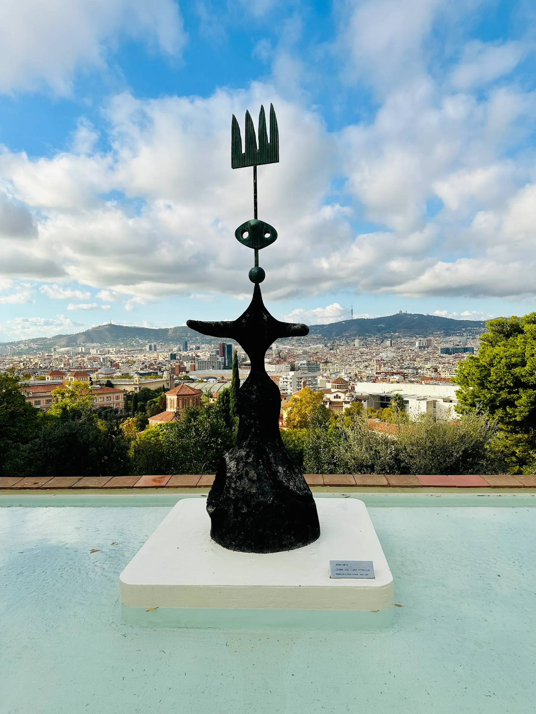 A sculpture beside a garden pond, Spain