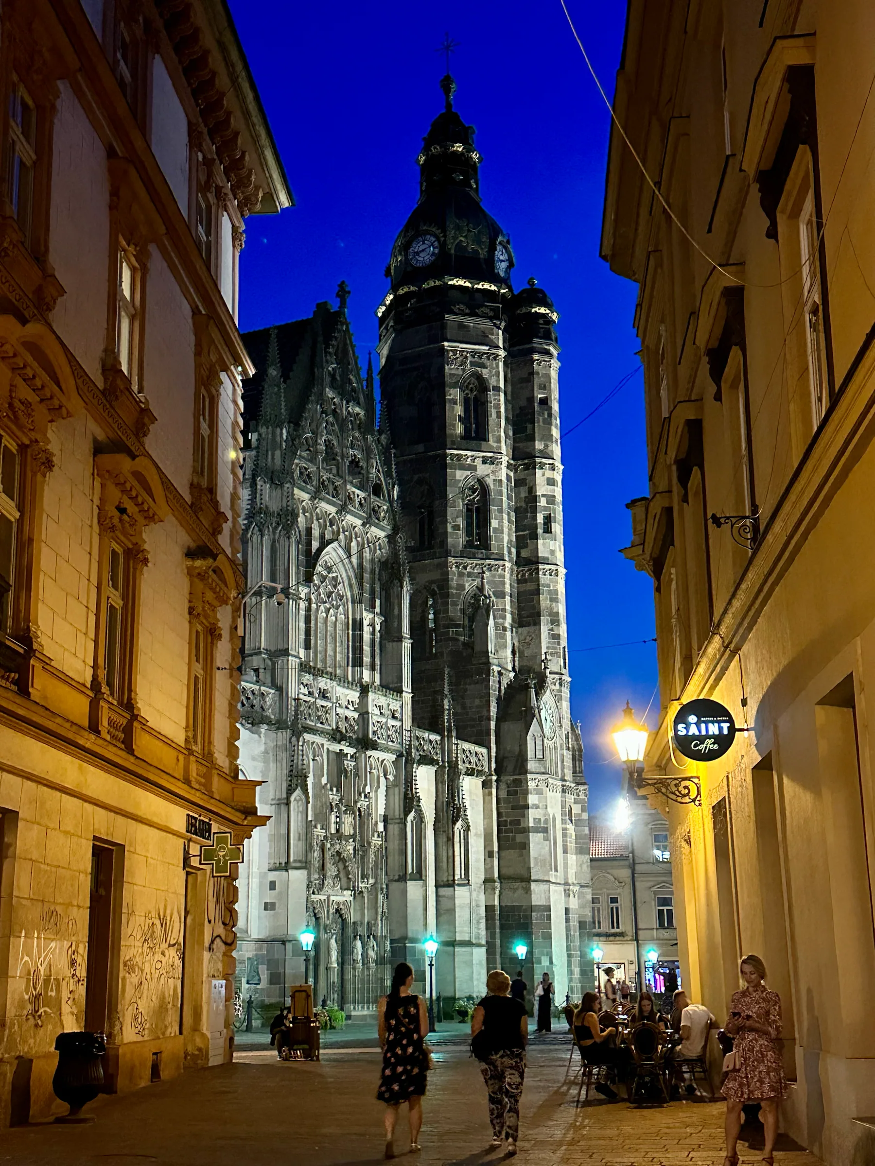 A church tower at the end of a night street, Slovakia