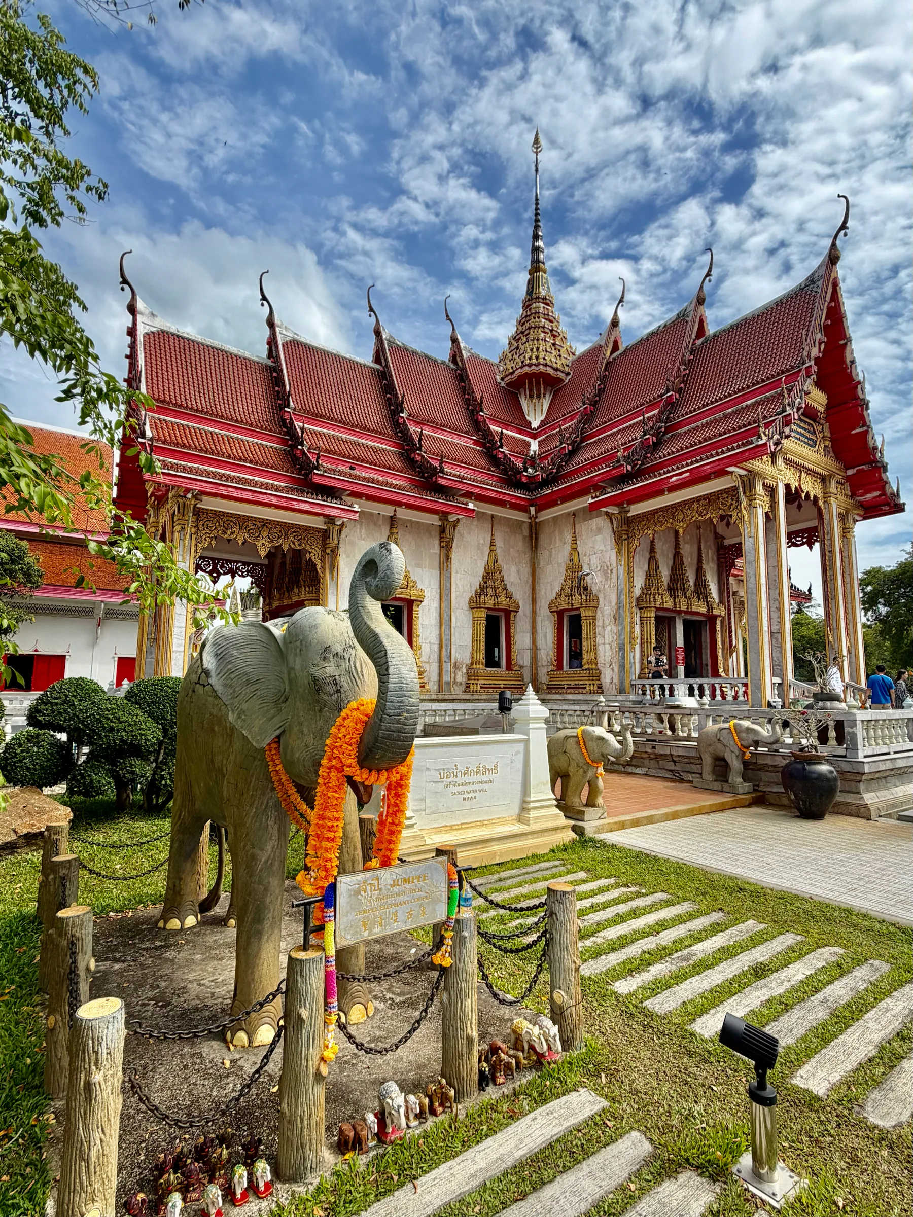 Temple buildings around a green courtyard, Thailand