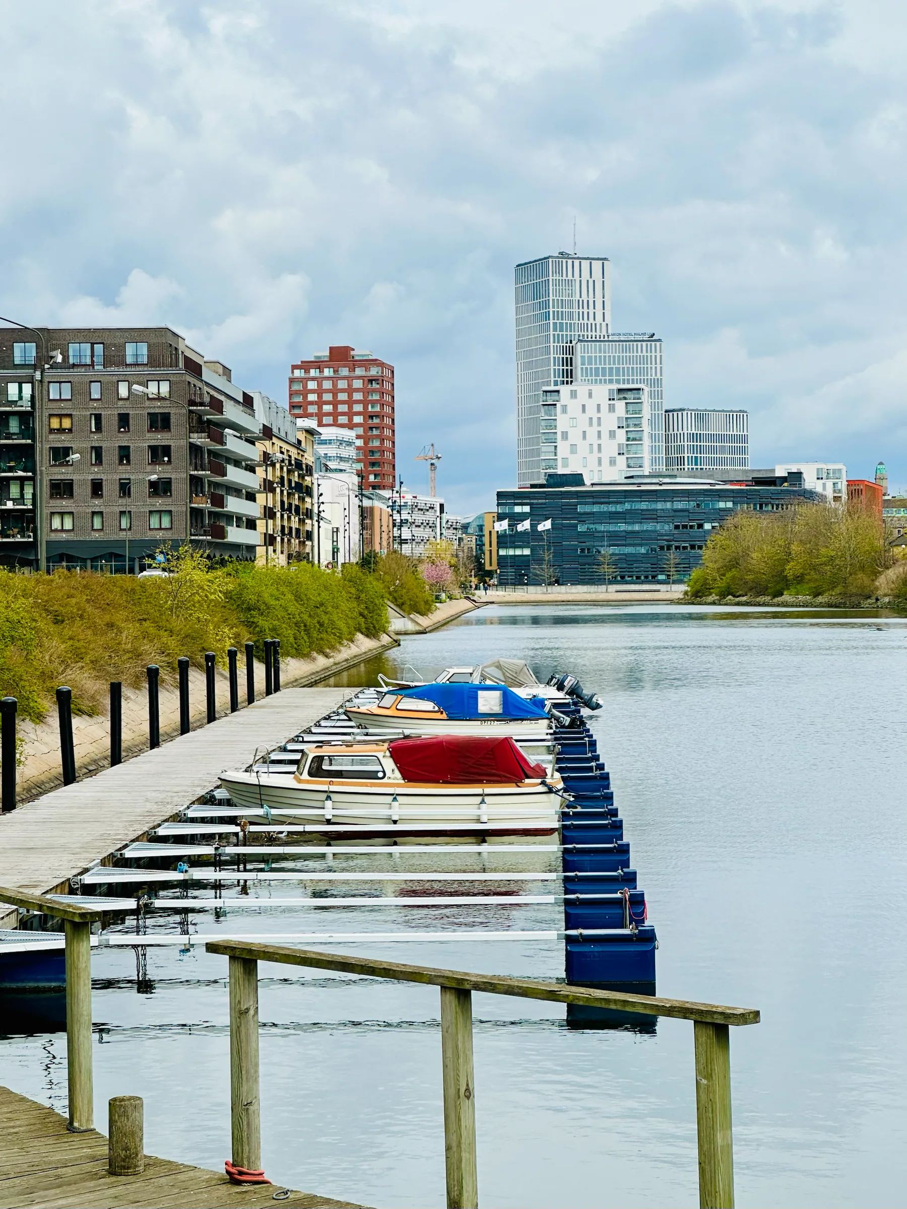 Boats moored along a city canal, Sweden