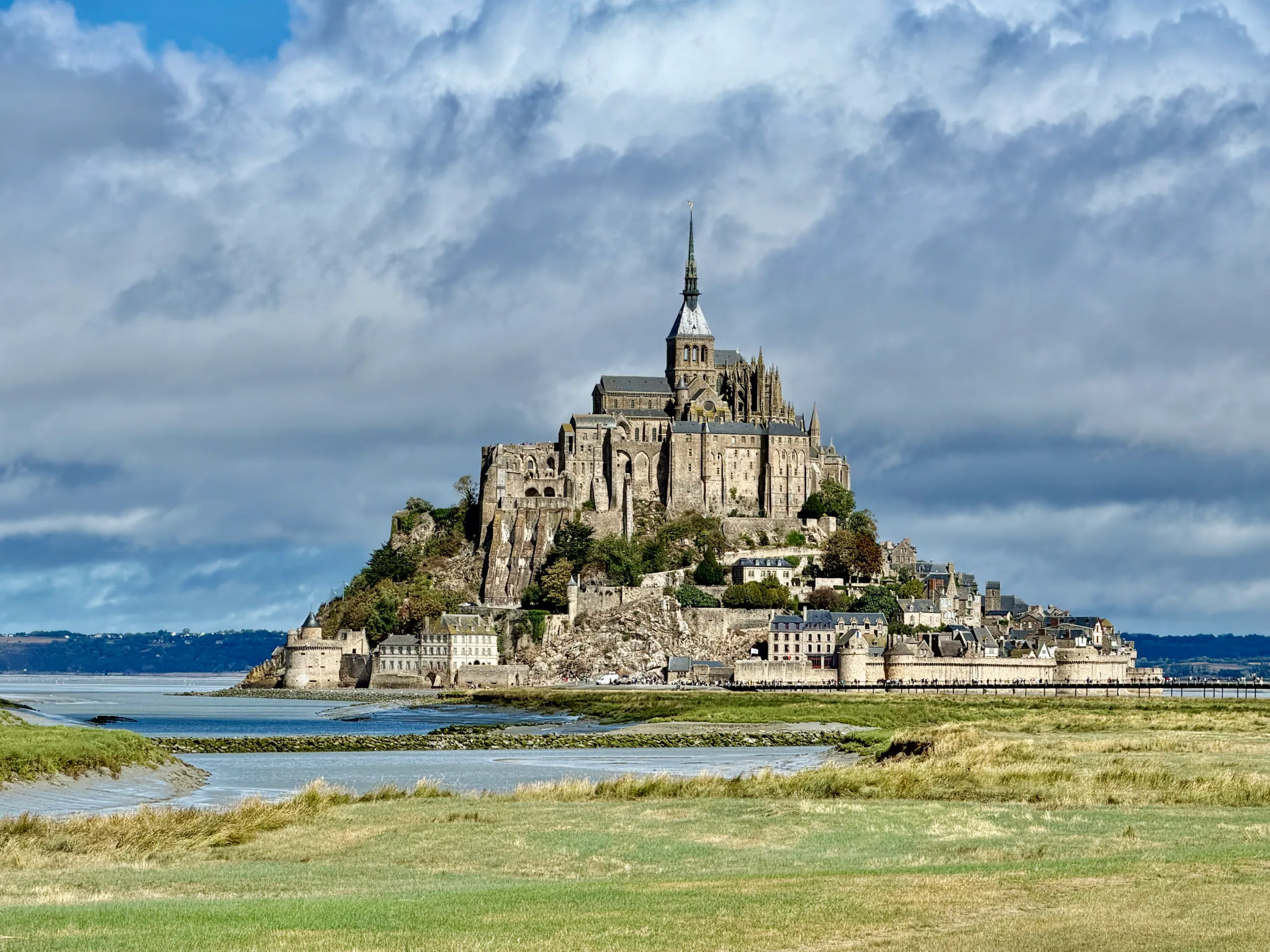 Mont Saint-Michel beneath passing clouds, France