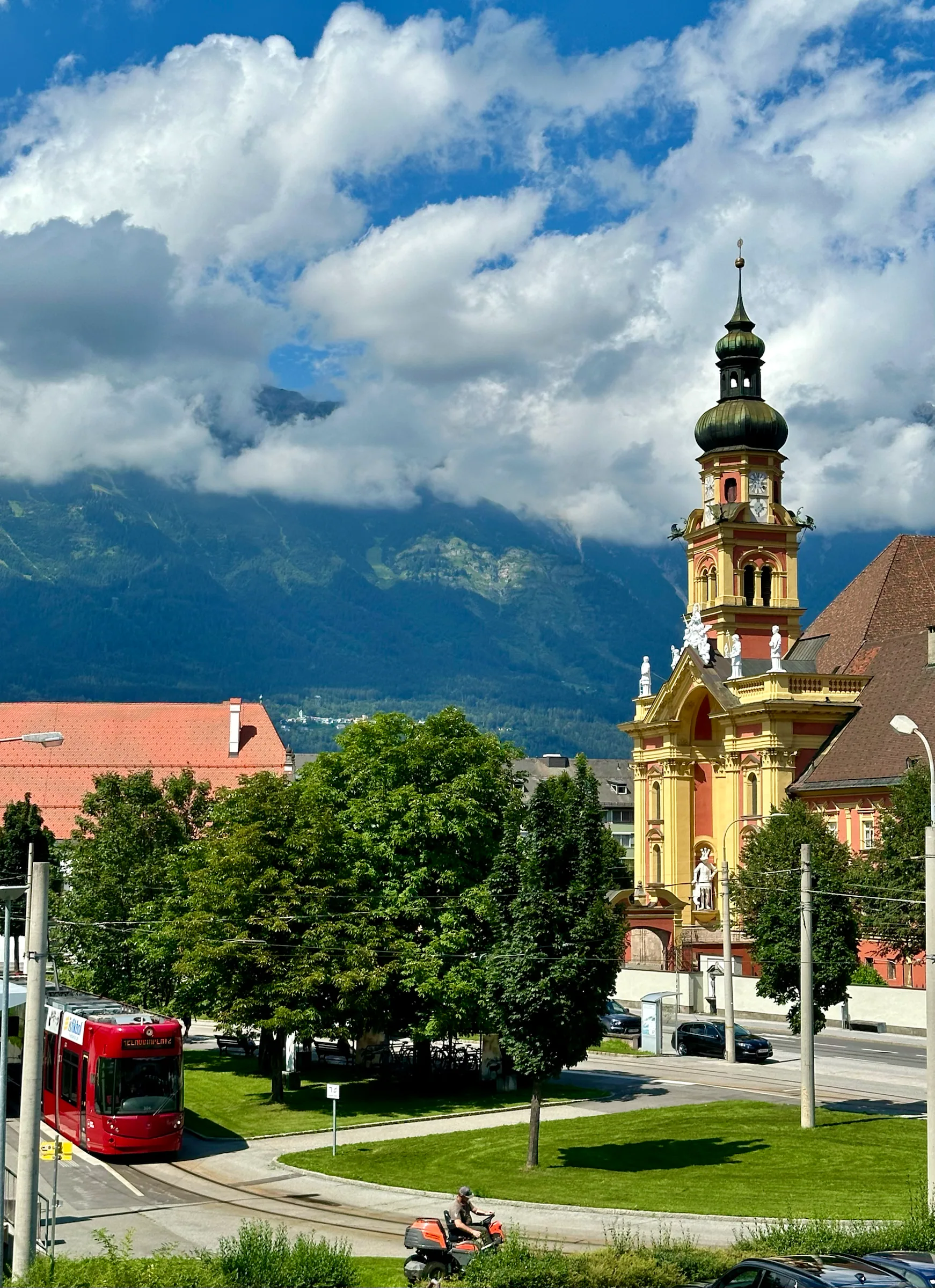 Church tower against a mountain backdrop, Austria