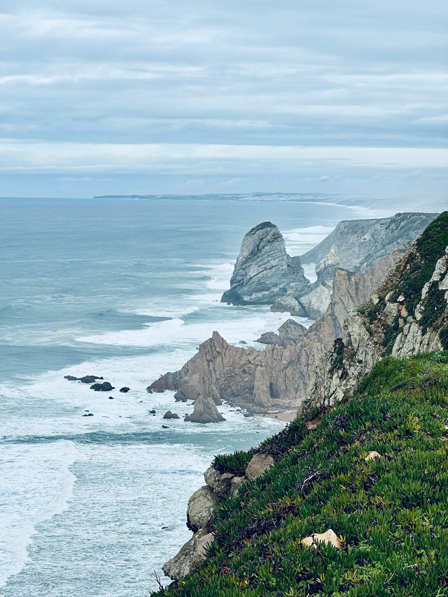 Atlantic waves below rugged cliffs, Portugal