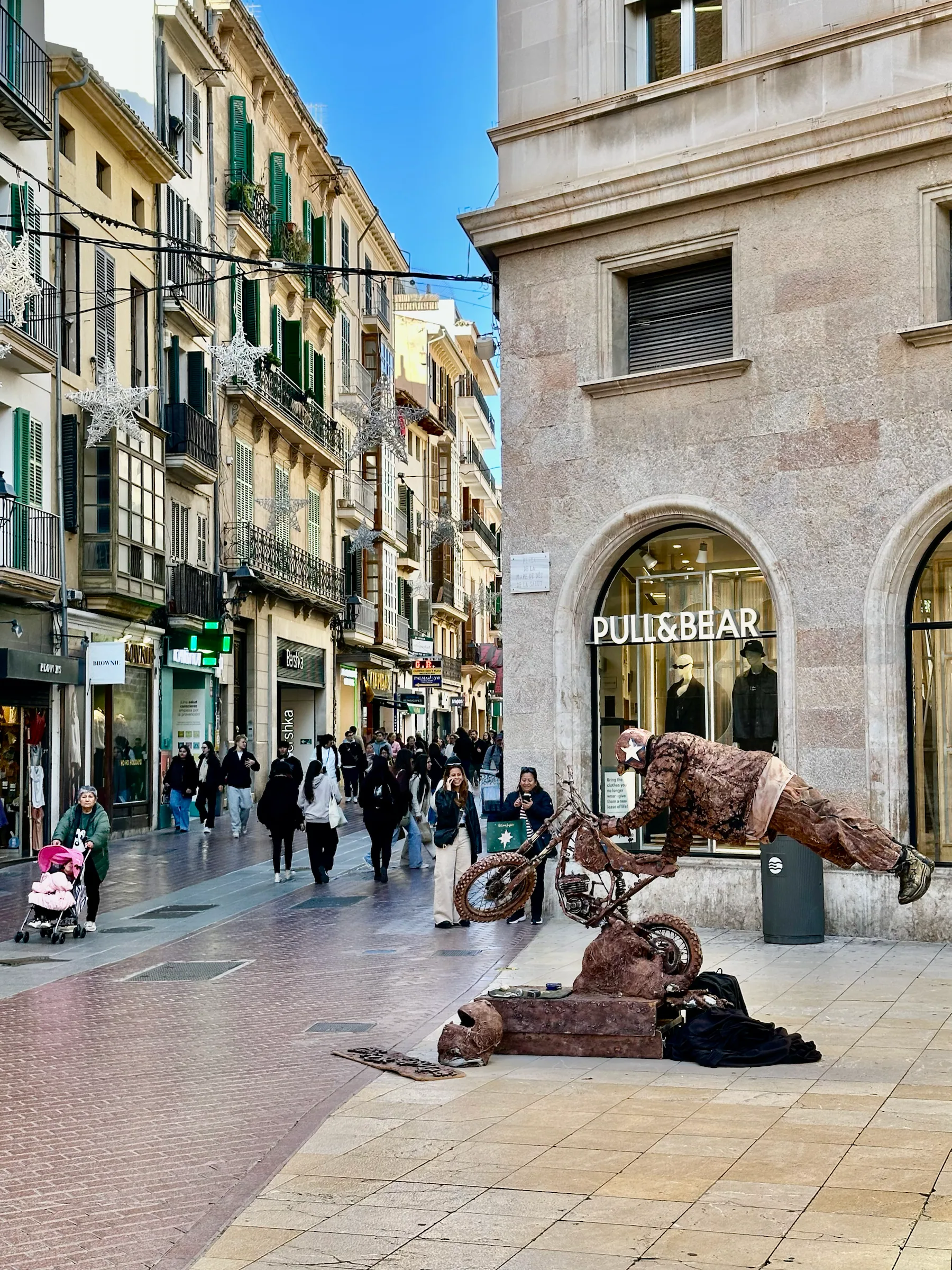 Colorful buildings along a shopping street, Spain