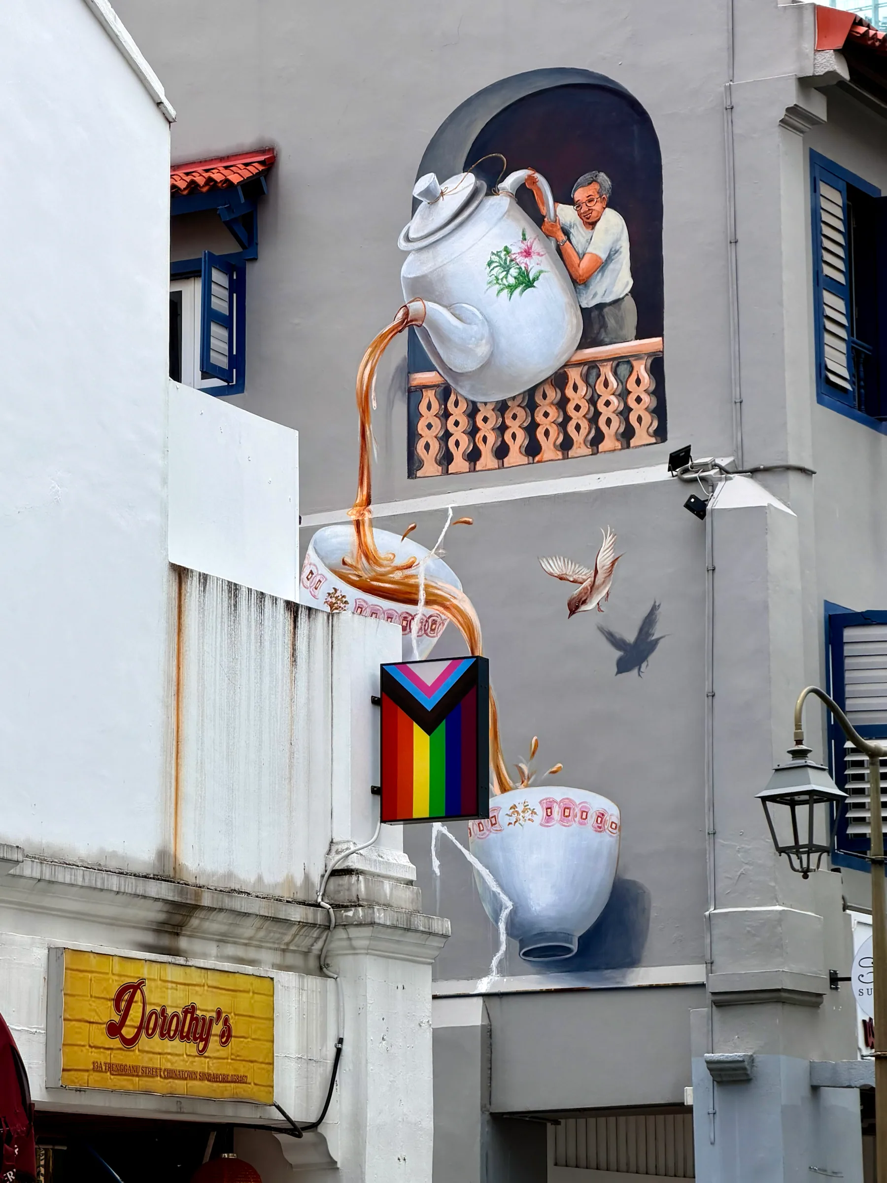 A mural beside a white facade, Singapore