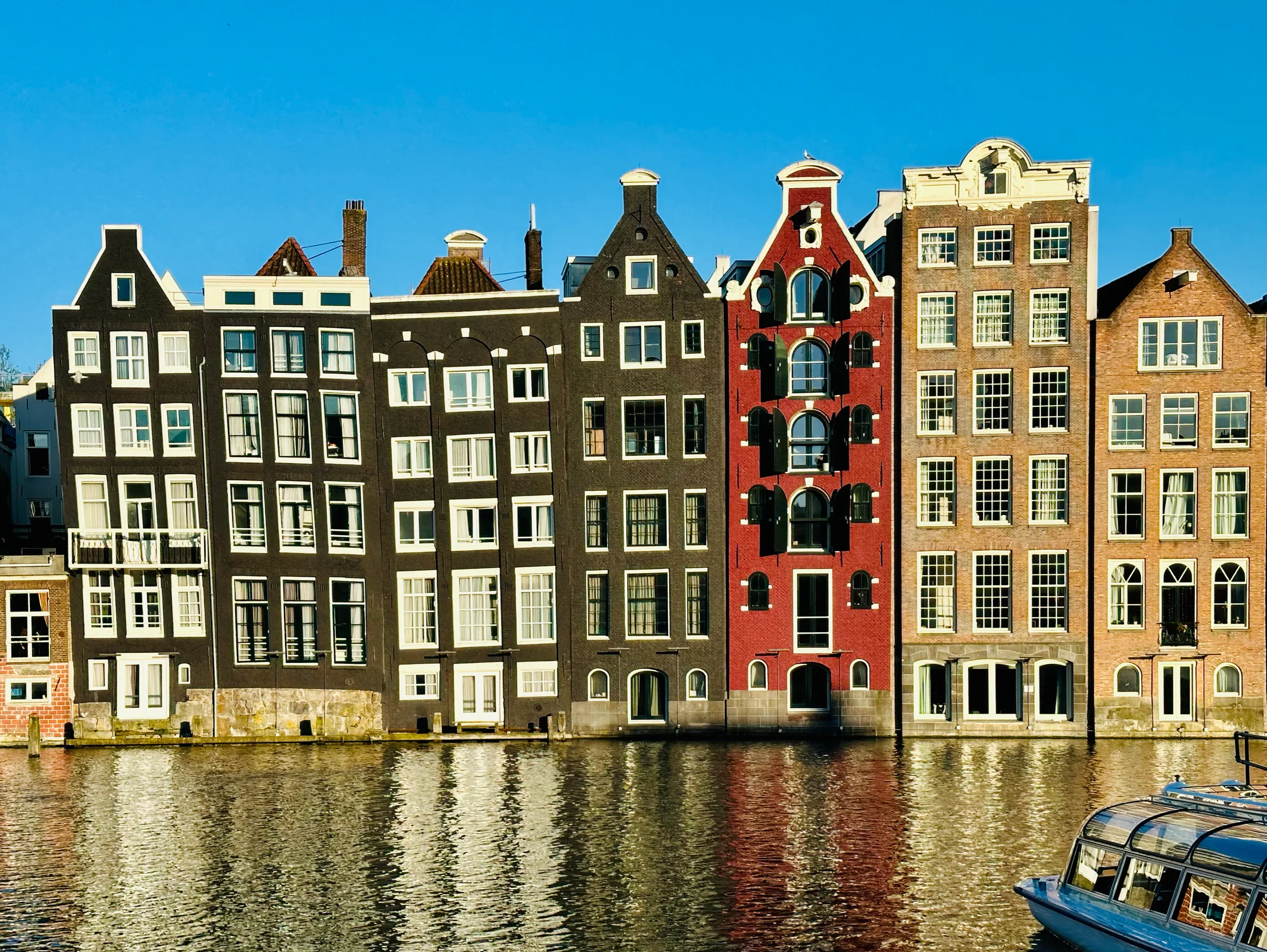 Canal houses reflected in still water, Netherlands